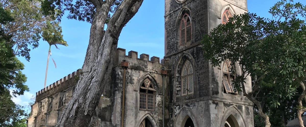 A historic church with arched windows and a clock tower.