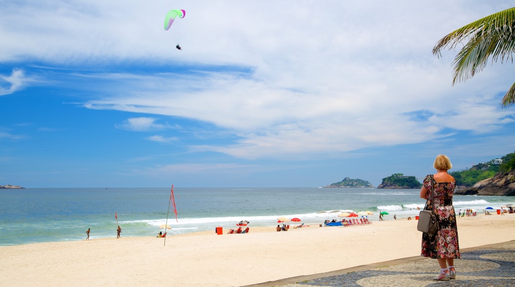 Sao Conrado Beach showing a beach as well as an individual femail