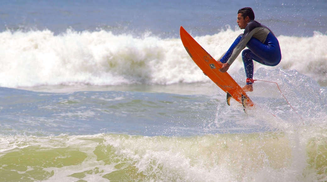 Prainha showing waves and surfing as well as an individual male