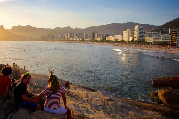 Arpoador Beach which includes a sunset