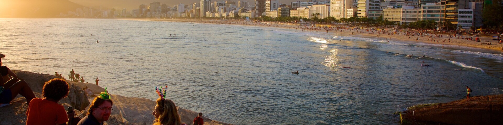 Arpoador Beach which includes a sunset