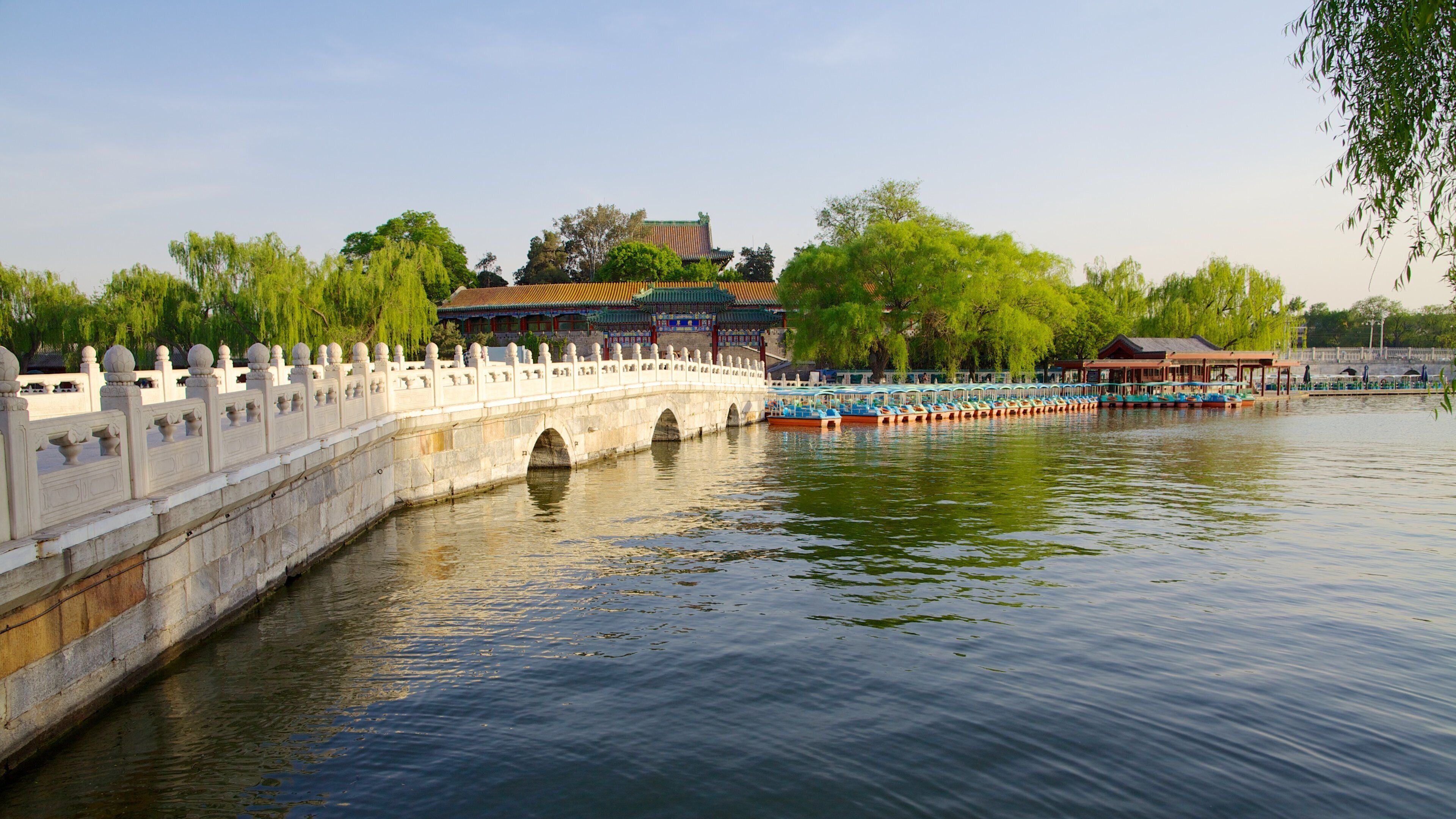 Beihai Park showing a river or creek, a bridge and a temple or place of worship