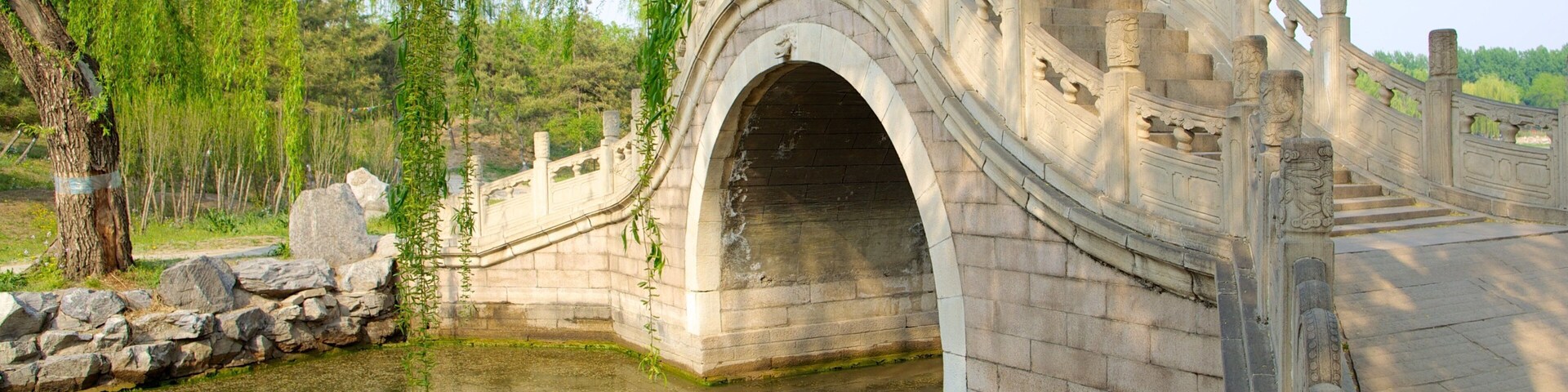 Old Summer Palace featuring a bridge, a river or creek and a park