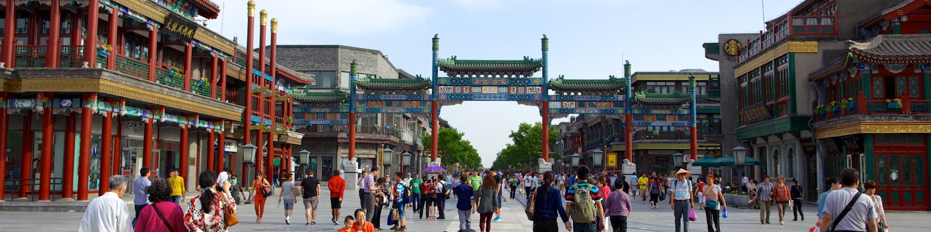Front Gate which includes a square or plaza and a city as well as a large group of people