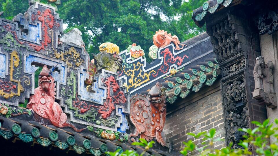 A traditional Chinese roof with colorful dragon sculptures and intricate patterns.