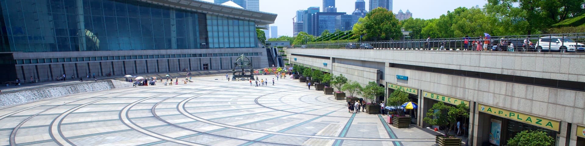 Shanghai Science and Technology Museum which includes a square or plaza, a city and modern architecture