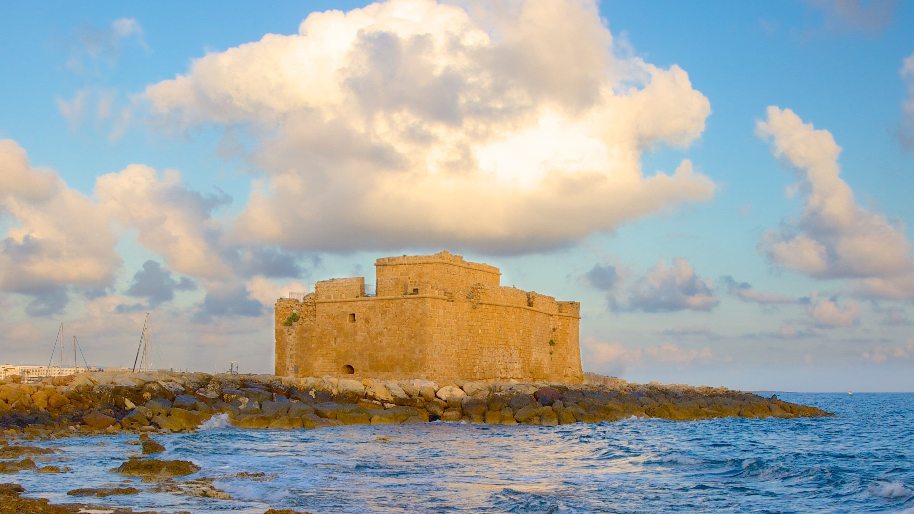 Paphos Castle featuring château or palace, building ruins and rugged coastline
