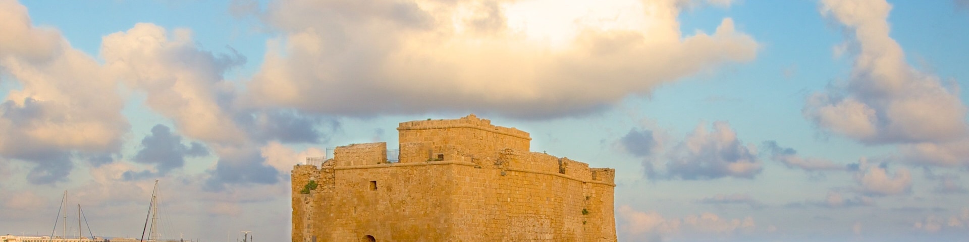 Paphos Castle which includes a ruin, chateau or palace and rugged coastline