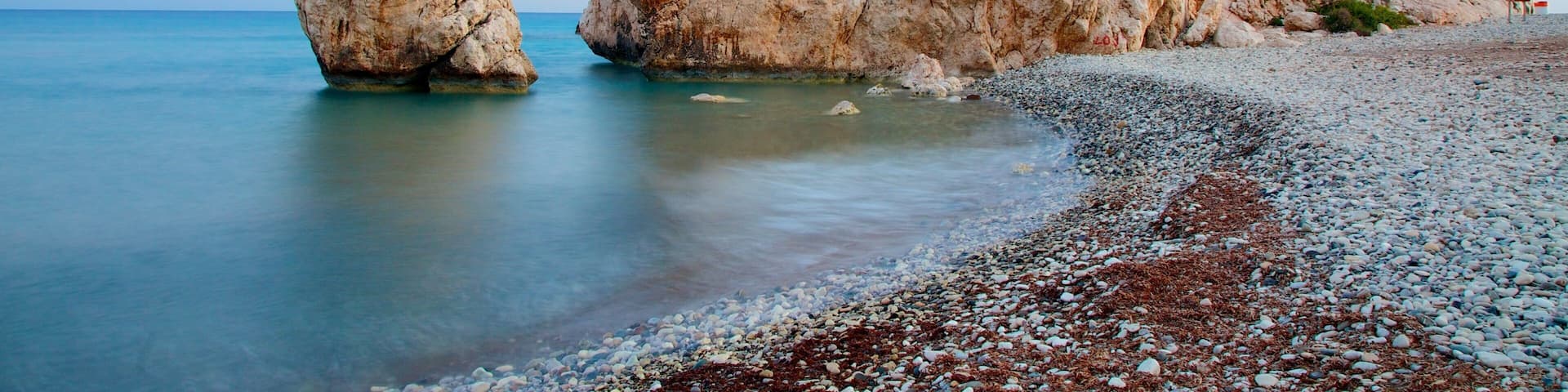 Aphrodite\'s Rock which includes a pebble beach