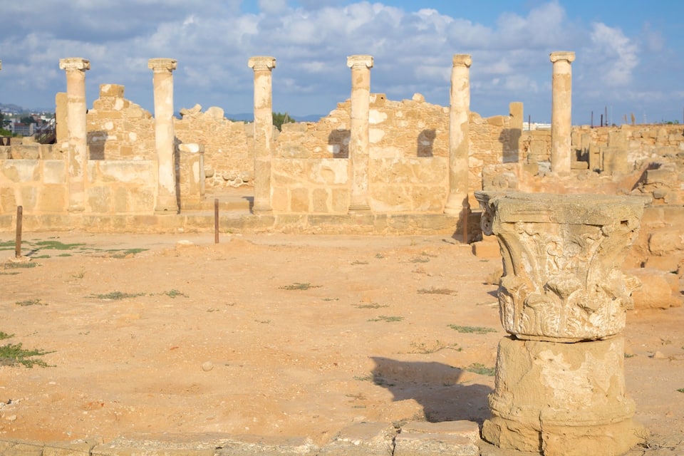 Ancient ruins with columns and stone structures.