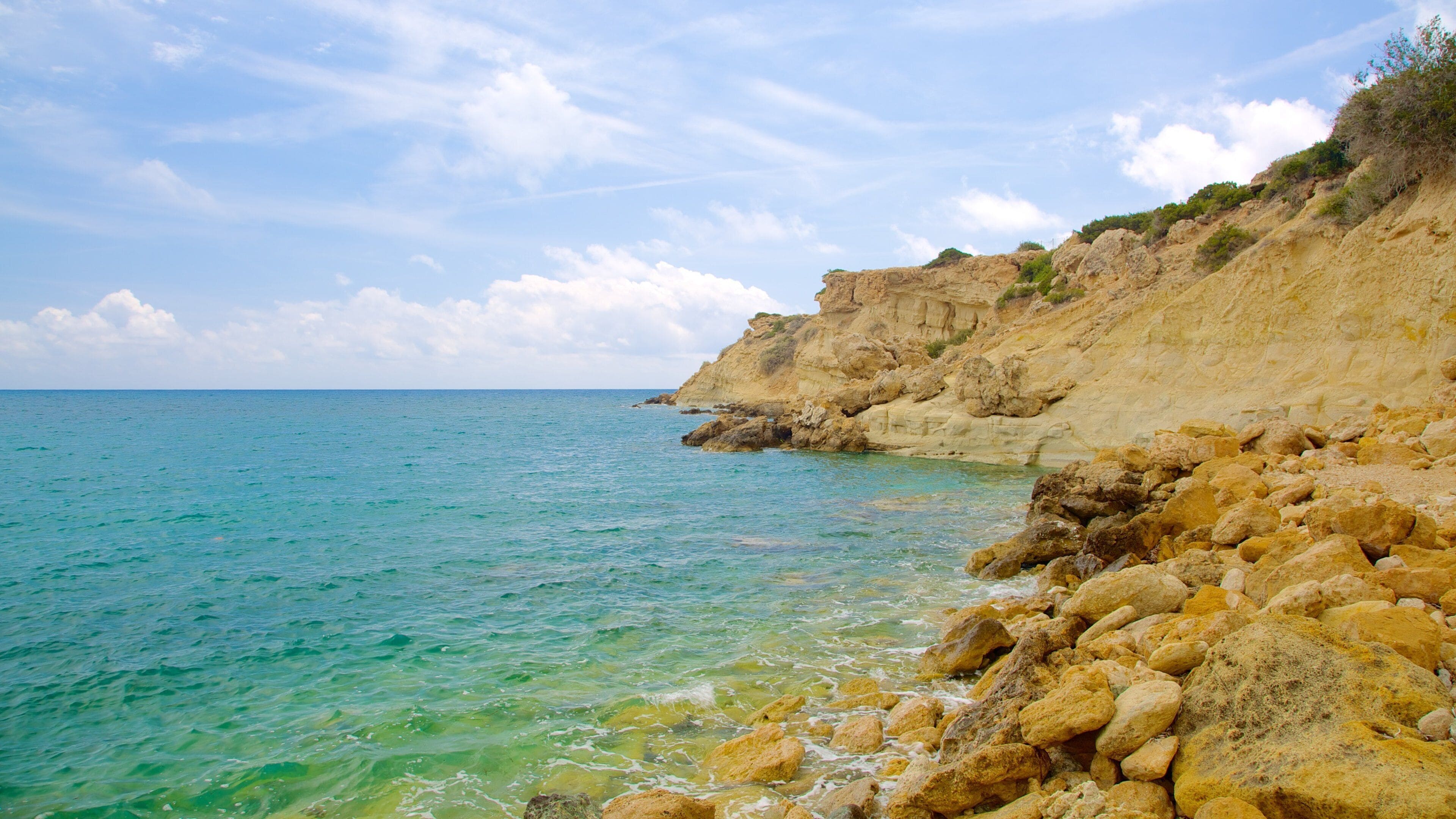 Coral Bay Beach featuring rugged coastline