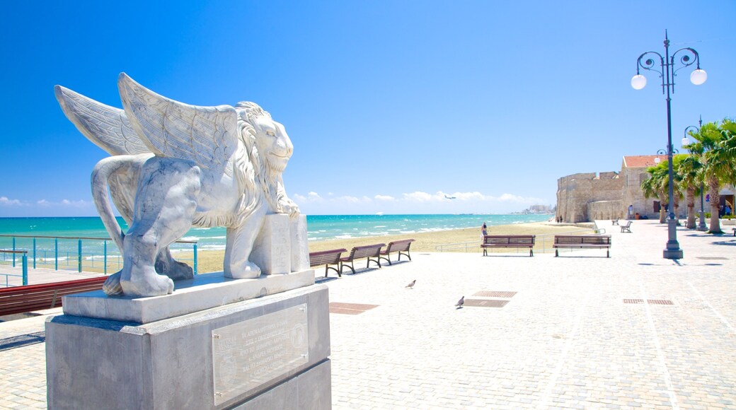 Finikoudes Beach which includes general coastal views and a statue or sculpture
