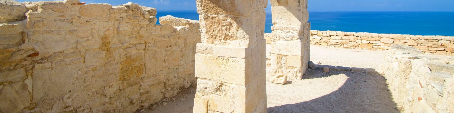 Ancient stone ruins with a clear view of the sea.