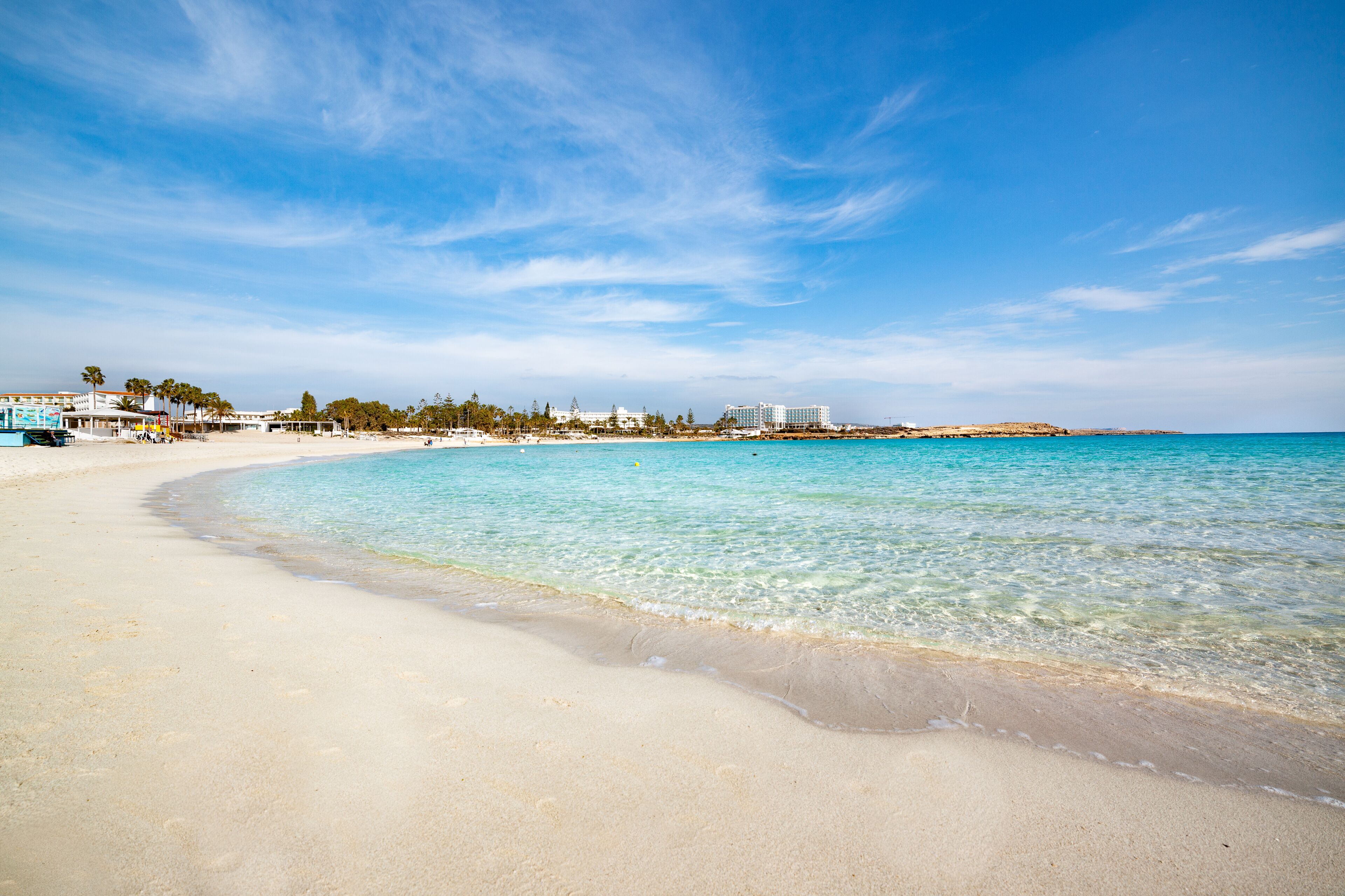 Famous Nissi beach, Ayia Napa. Famagusta District, Cyprus. Traces on sand and blue lagoon.