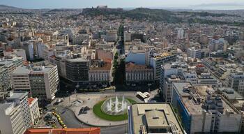 Aerial drone photo of recently renovated Omonoia square featuring huge round fountain, Athens centre, Attica, Greece