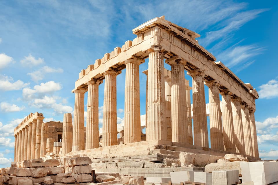 The Parthenon, an ancient Greek temple with Doric columns, situated on the Acropolis.