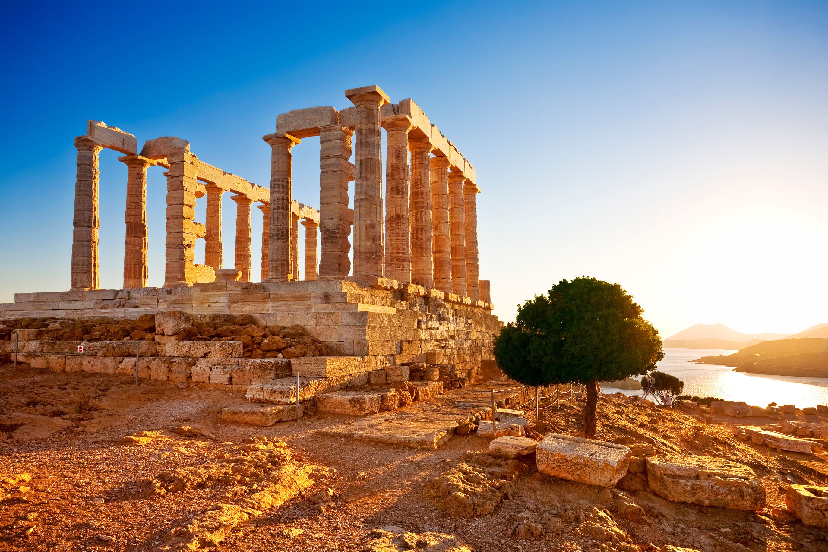 Greece. Cape Sounion - Ruins of an ancient Greek temple of Poseidon before sunset