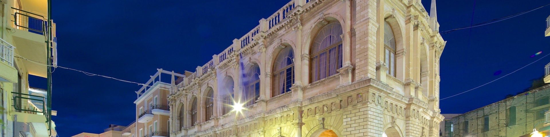 Heraklion Loggia which includes heritage architecture, night scenes and street scenes
