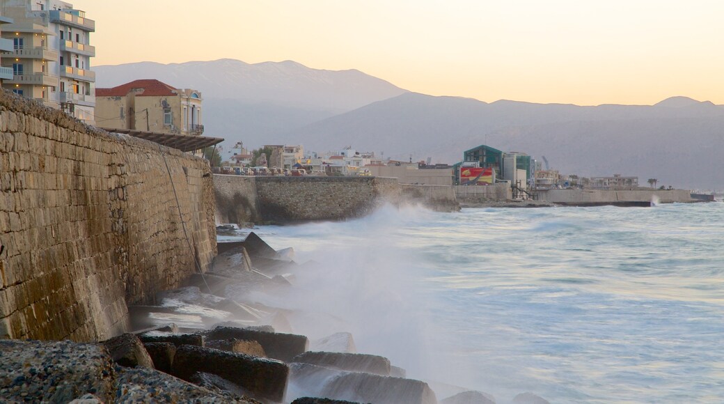 Heraklion Port featuring rocky coastline, a sunset and a marina