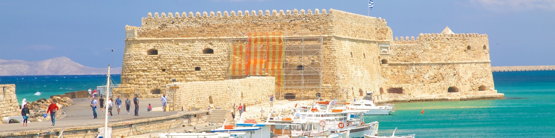 Koules Fortress which includes a bay or harbor, heritage architecture and chateau or palace