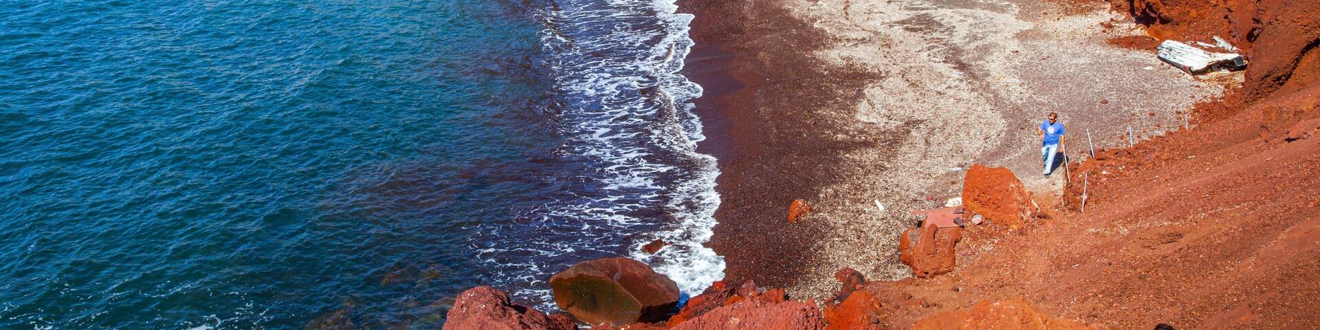 Red Beach which includes rocky coastline and general coastal views as well as an individual male