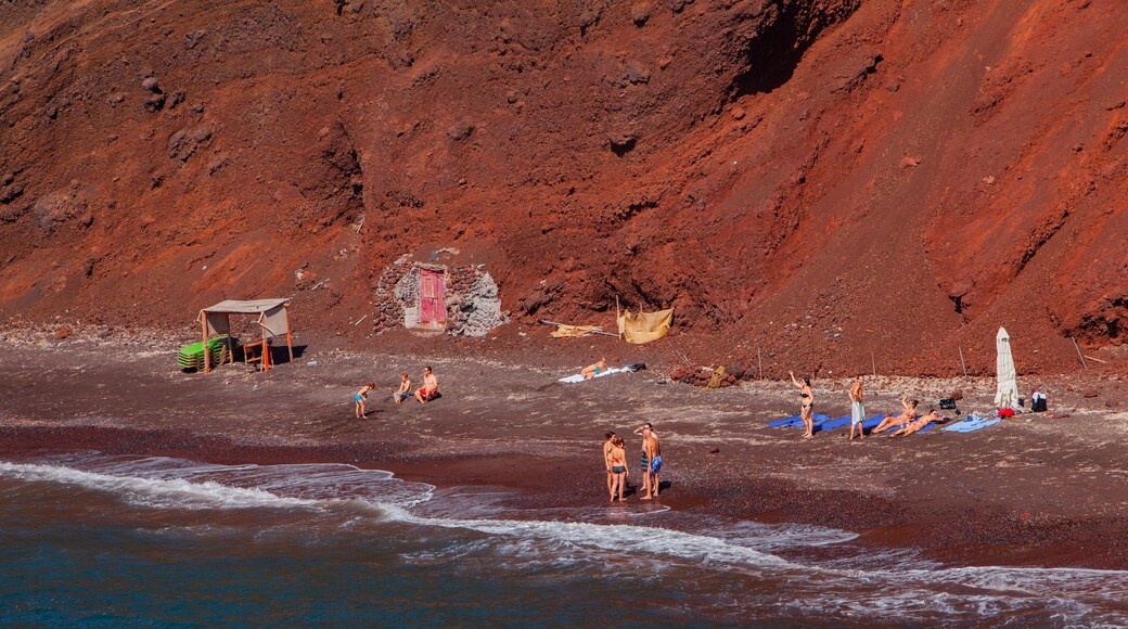 Santorini showing general coastal views and rocky coastline as well as a small group of people