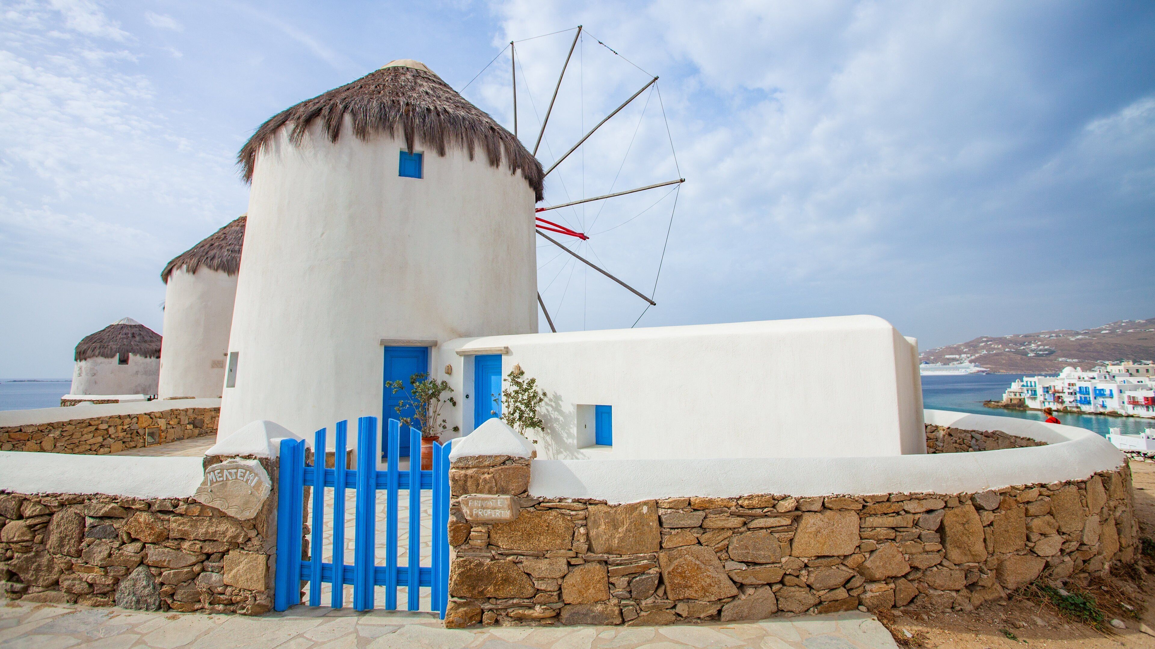 Windmills of Mykonos which includes a windmill and heritage architecture