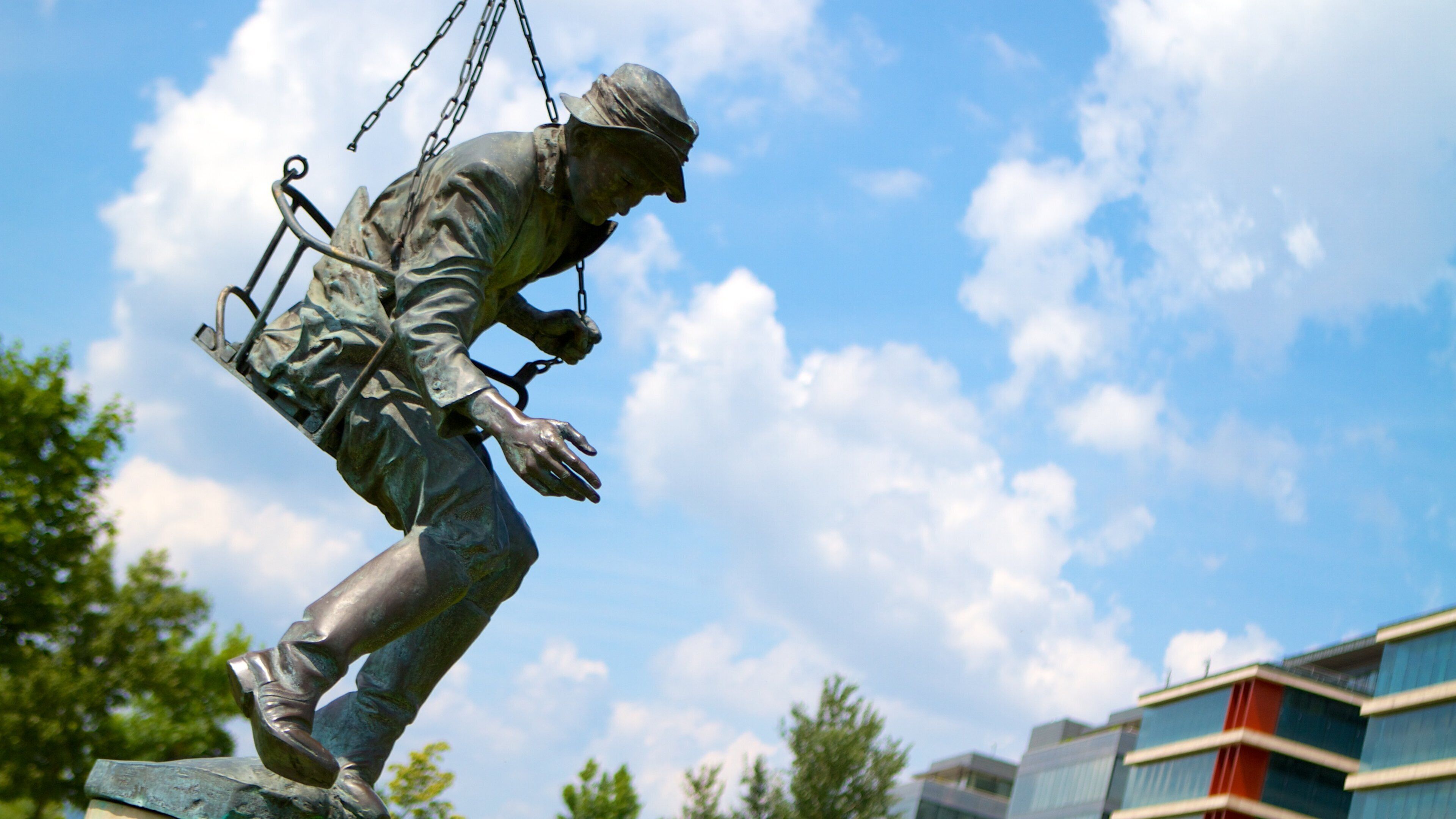 National Theater which includes a statue or sculpture, outdoor art and theatre scenes