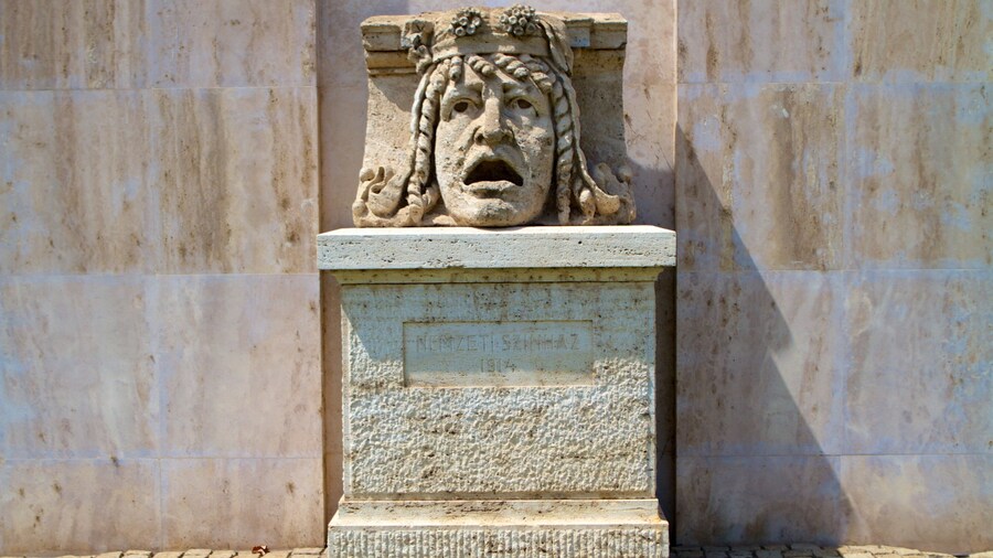 National Theater showing a statue or sculpture and theater scenes