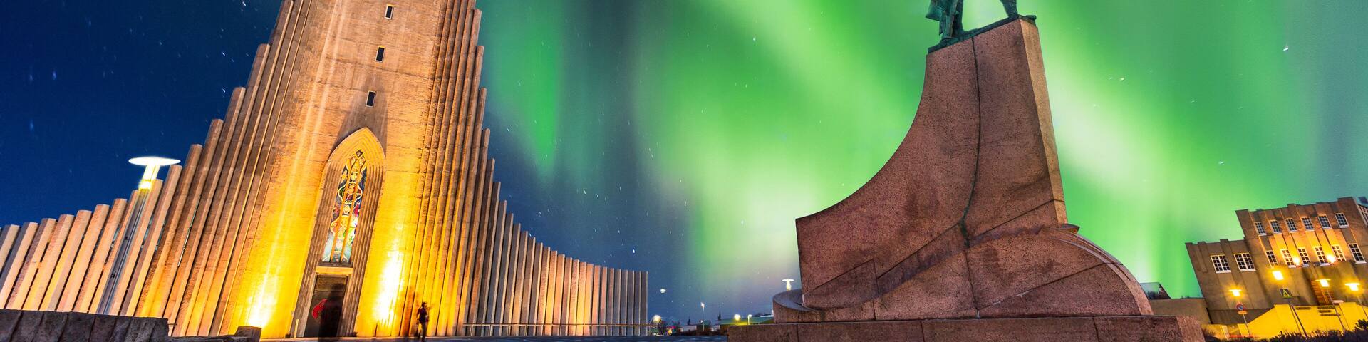 aurora borealis above hallgrimskirkja church in central of reykjavik city in Iceland, Shutterstock ID 1146085949, Purchase Order: SP-1506 Go Guides, Order Number: , Client/Licensee: Faa Praharnpap, Ot