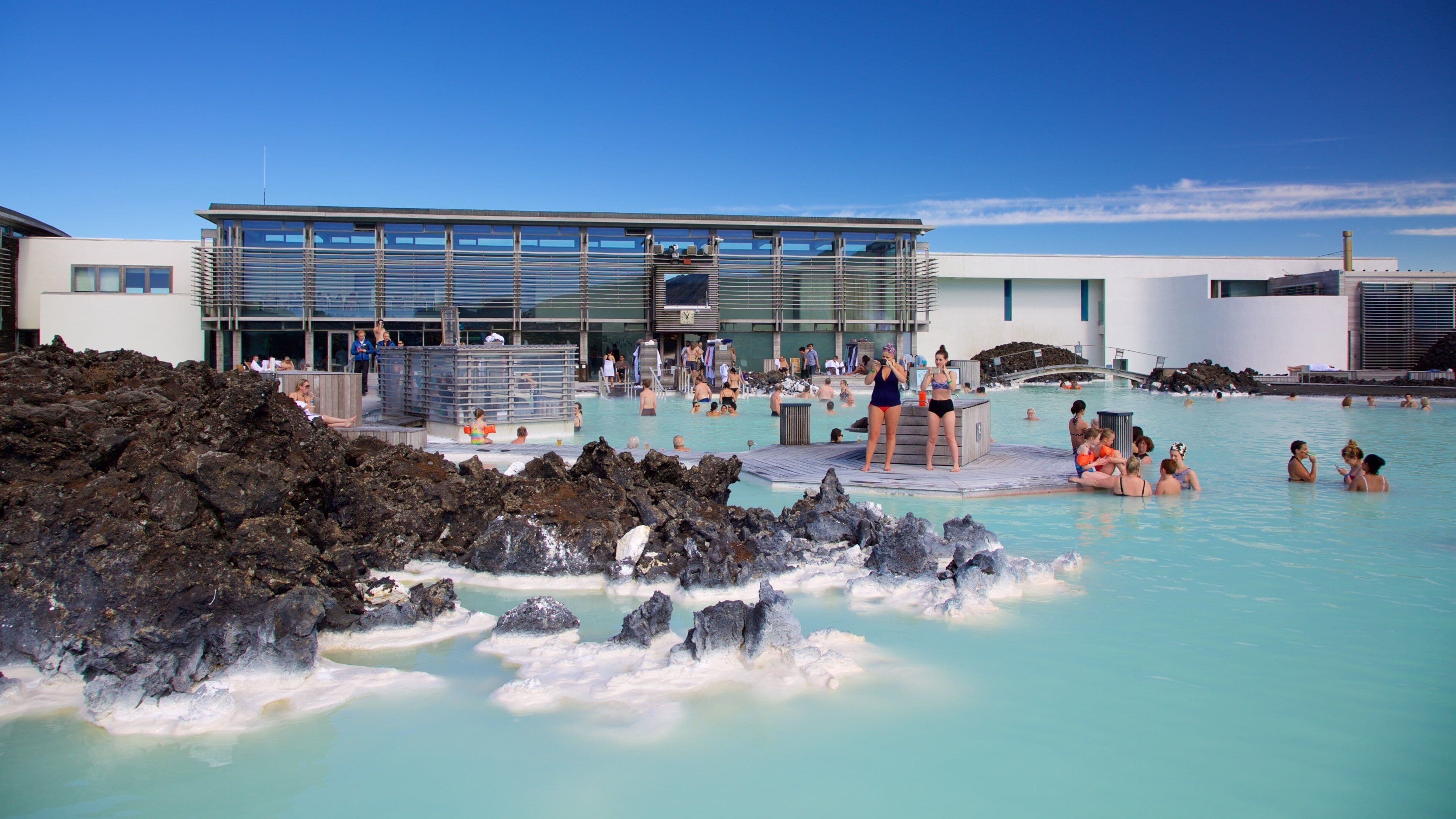 Blue Lagoon featuring a luxury hotel or resort and a hot spring as well as a large group of people