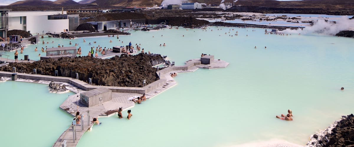 Blue Lagoon which includes a luxury hotel or resort and a hot spring as well as a large group of people