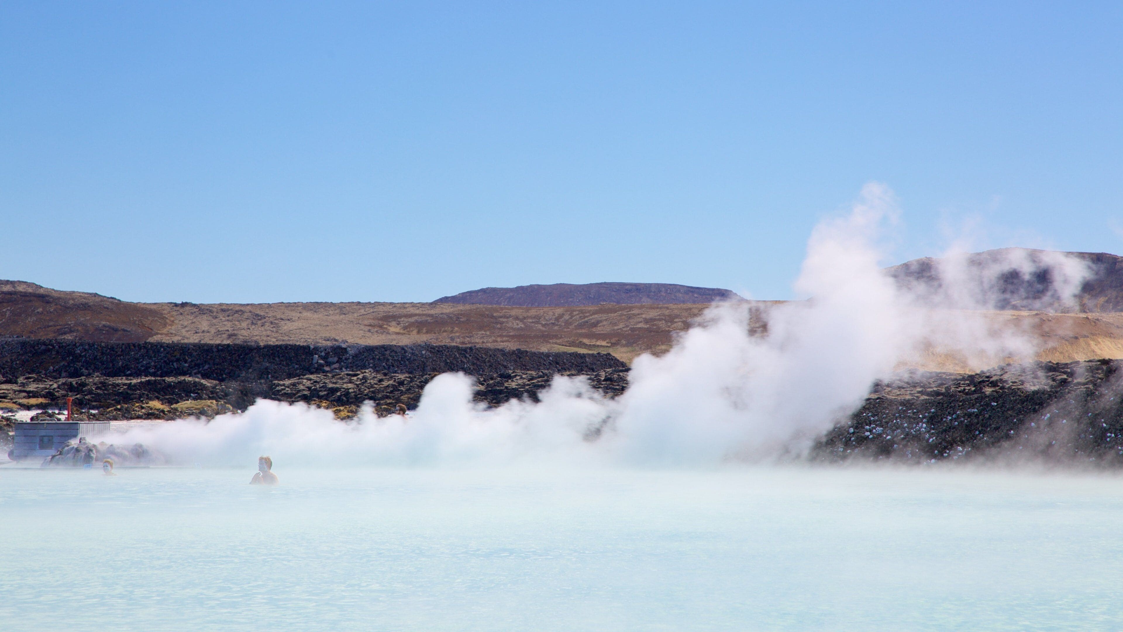 Blue Lagoon showing mist or fog and a hot spring