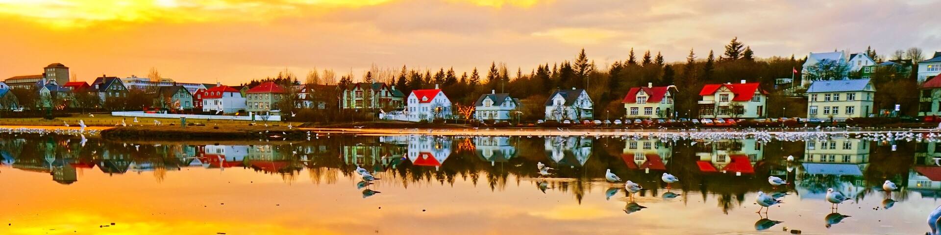 View of the Tjornin Lake in Reykjavik at sunset in winter., Shutterstock ID 1222302634, Purchase Order: -