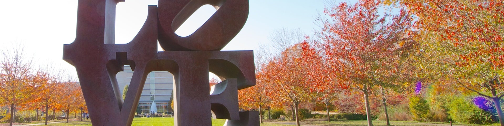 Indianapolis Museum of Art which includes signage, fall colors and a garden