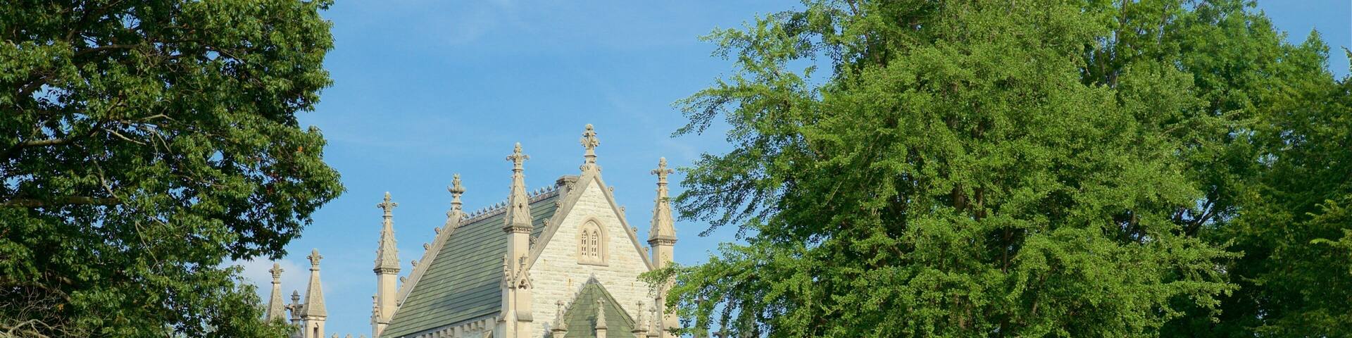 A historic church with a graveyard in front.