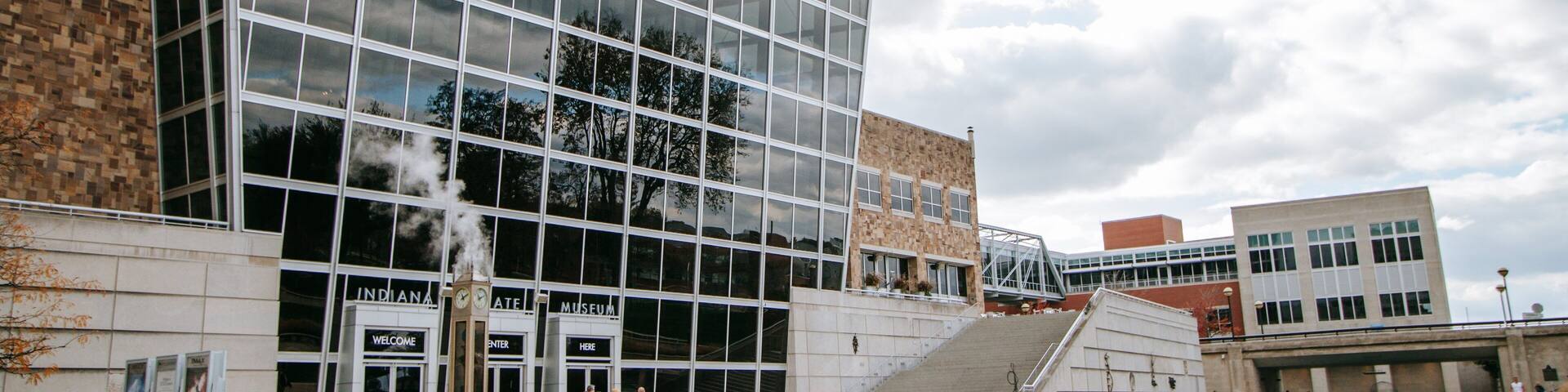 A modern building with large windows and a clock tower.