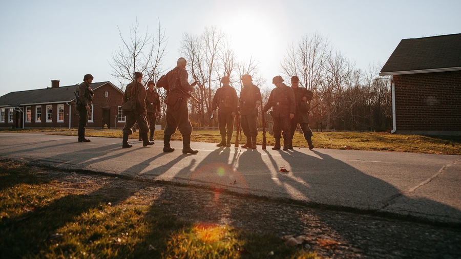Fort Harrison State Park featuring military items and a sunset as well as a small group of people
