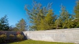 A stone wall with the inscription "Fort Harrison State Park Indiana Department of Natural Resources".