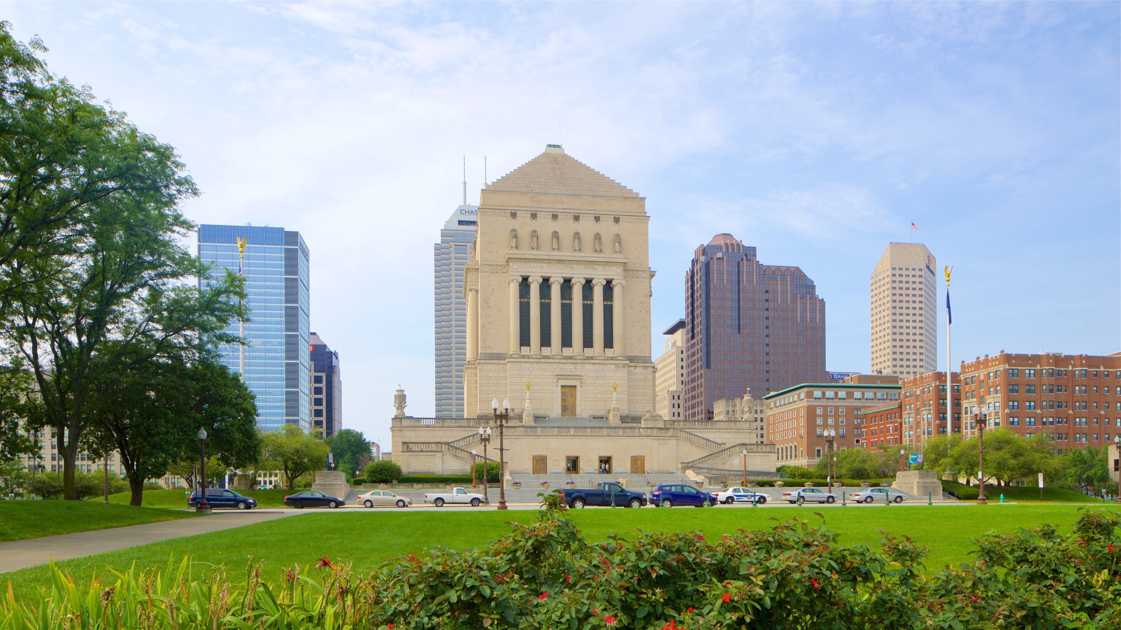 Downtown Indianapolis showing heritage architecture, a park and a city
