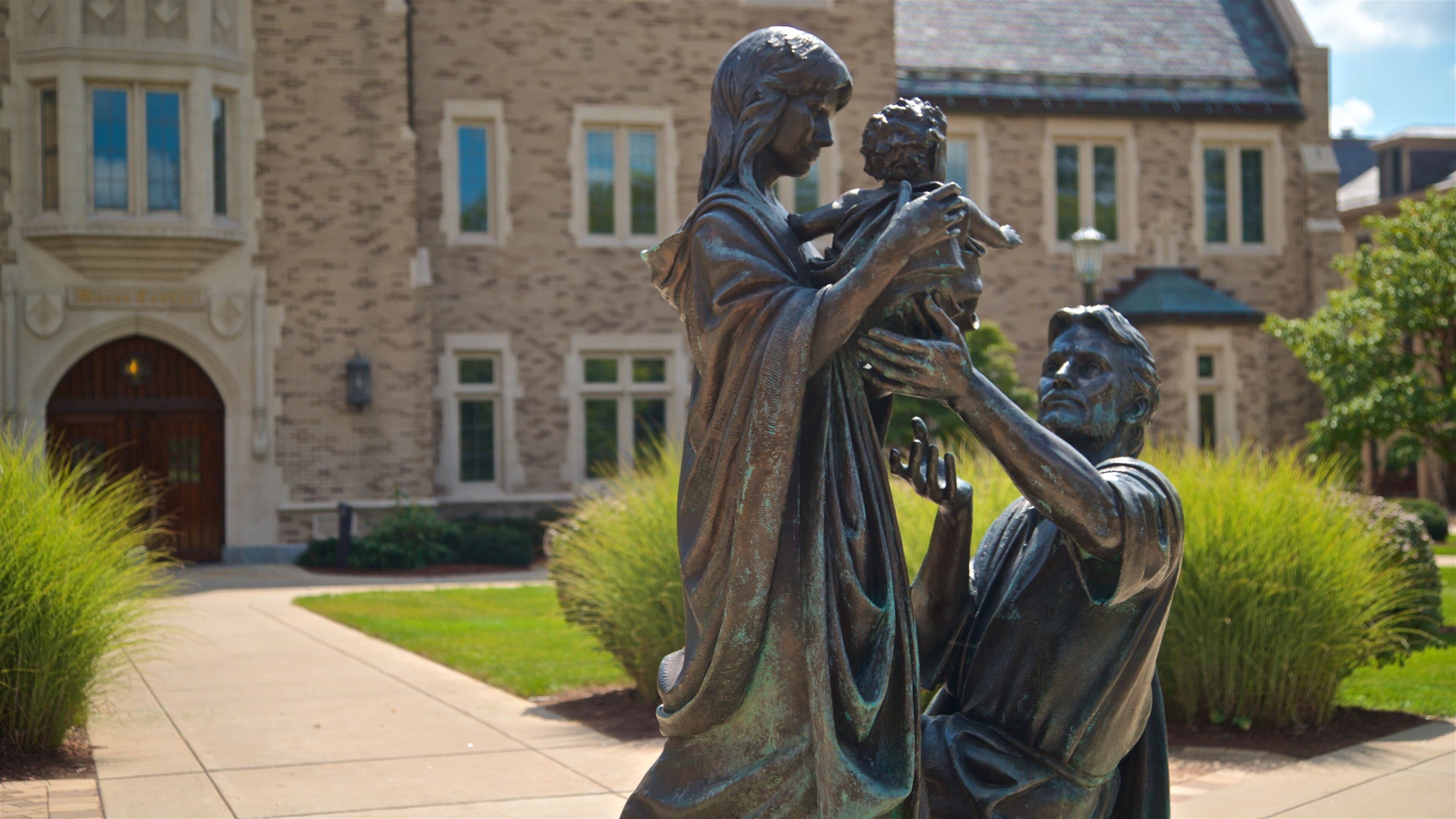 Basilica of the Sacred Heart showing a garden and a statue or sculpture