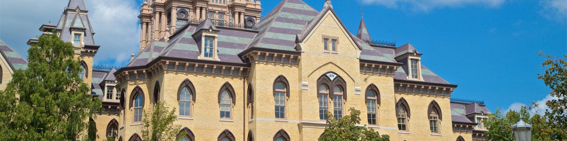 A historic building with a large golden dome and multiple spires.