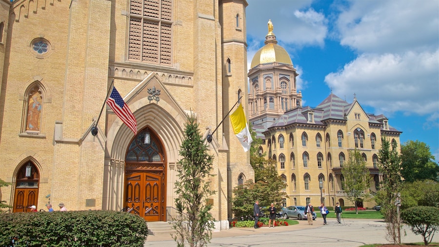 Basilica of the Sacred Heart which includes heritage architecture and a church or cathedral as well as a small group of people