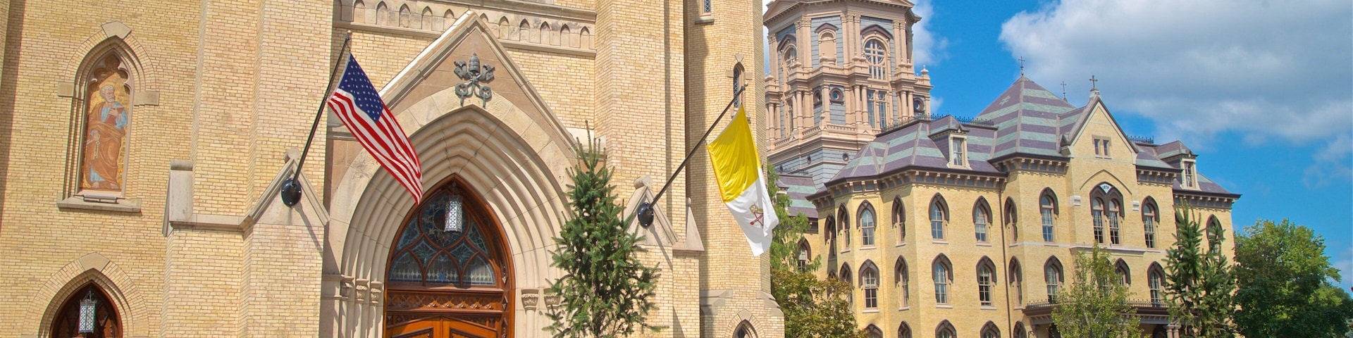 Basilica of the Sacred Heart showing a church or cathedral and heritage architecture as well as a small group of people
