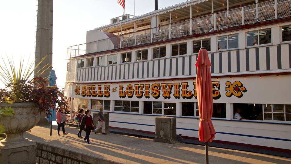 Belle of Louisville which includes signage and a ferry as well as a small group of people