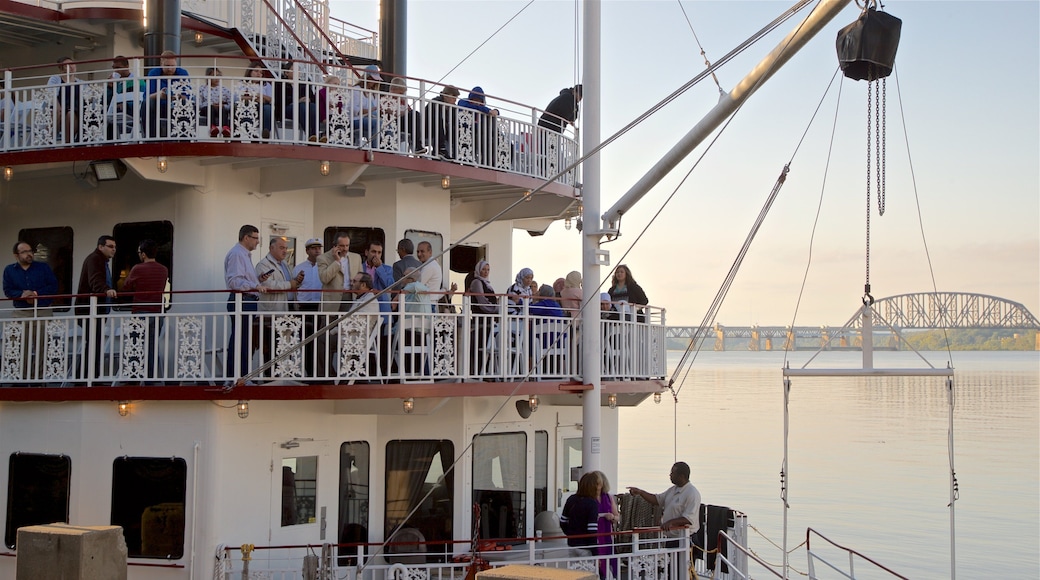 Belle of Louisville showing a bay or harbor and a ferry as well as a small group of people