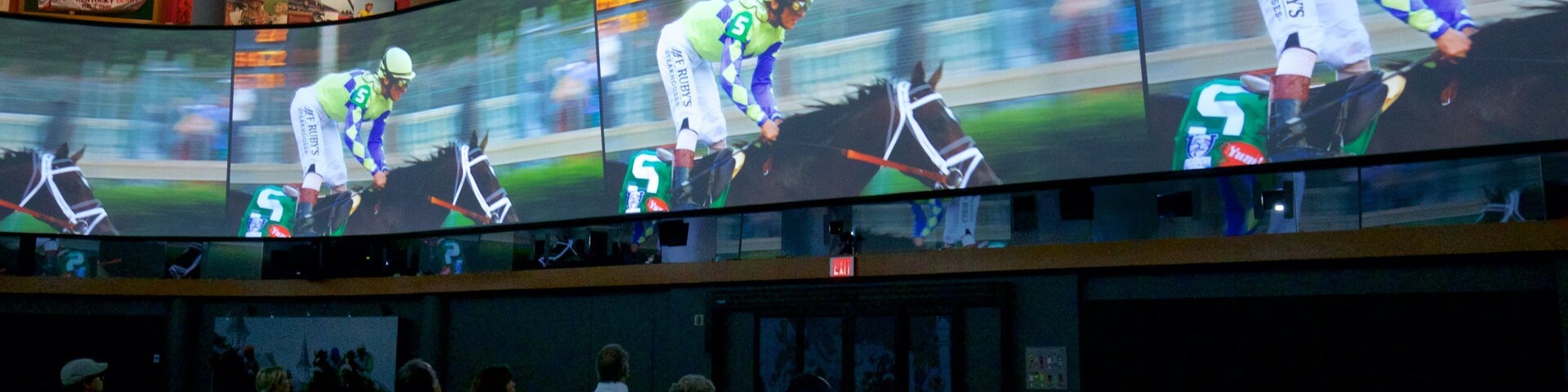 Kentucky Derby Museum featuring interior views as well as a small group of people