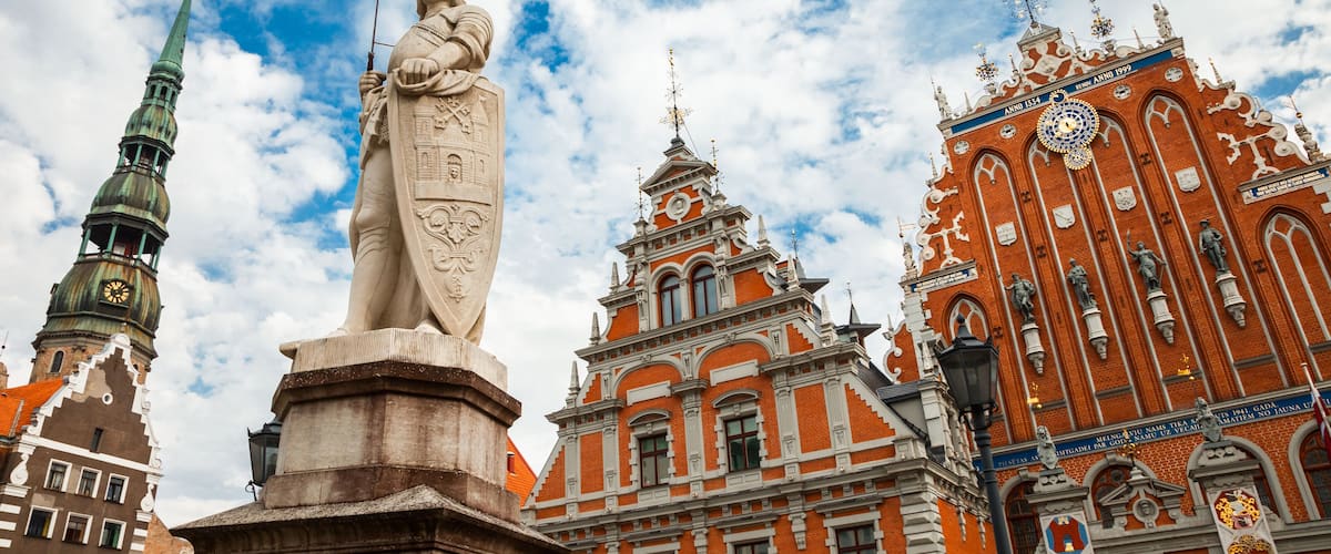 Latvian attraction - house of the Blackheads, sculpture of Saint Roland and Saint Peters Church in old city Riga, Latvia, Shutterstock ID 309897689, Purchase Order: SP-1506 Go Guides, Order Number: ,