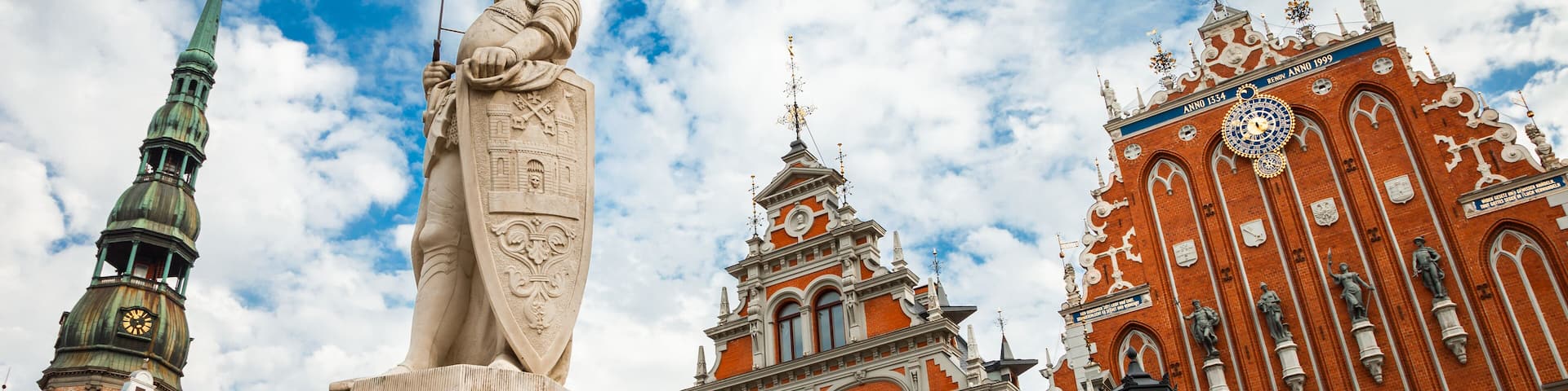 Latvian attraction - house of the Blackheads, sculpture of Saint Roland and Saint Peters Church in old city Riga, Latvia, Shutterstock ID 309897689, Purchase Order: SP-1506 Go Guides, Order Number: ,