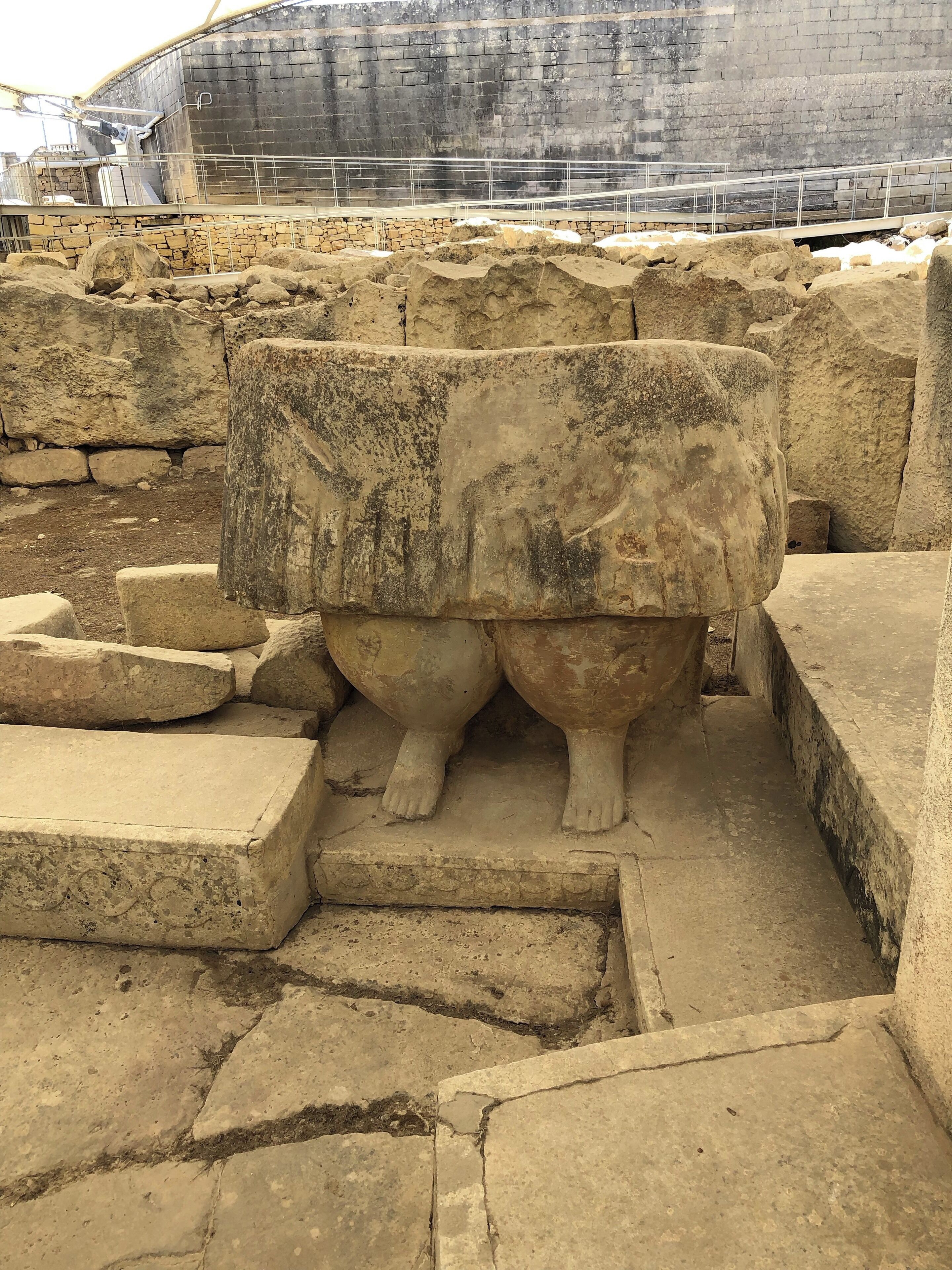 View of a portion of a sculpture located at a place known as the Tarxien Temples in the Mediterranean country of Malta.

These temples are older than Stonehenge in England, and are among the oldest still standing stone structures in the world. 

The people who constructed these temples disappeared long ago, and little is known about their culture.